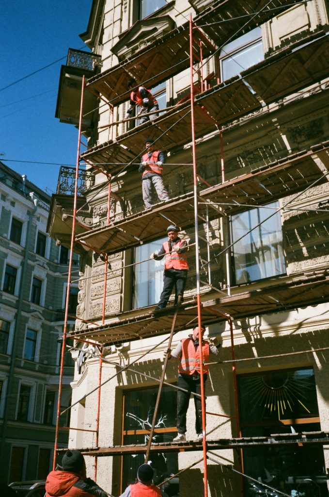 men on brown scaffolding 2209529